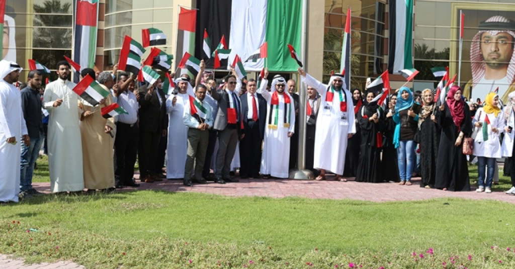 Ajman University Joins the National Initiative and Raises the UAE Flag
