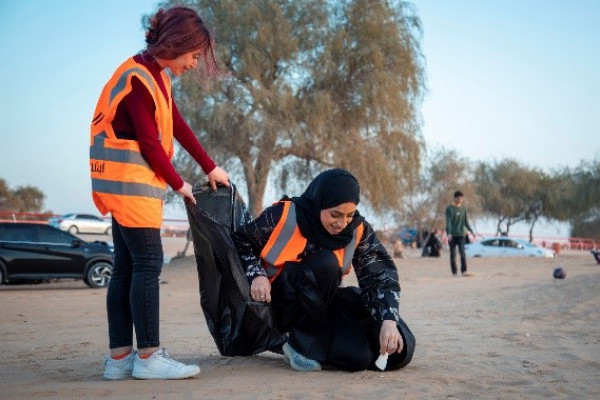 Ajman University female residents Volunteer in “Clean the Land” to support environmental sustainability.