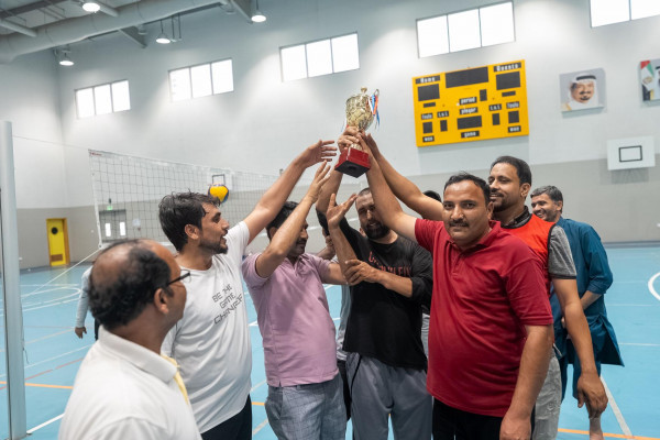 Ajman University’s Athletics Unit Organizes Volleyball Tournament for Taxi Drivers to Promote Health and Well-Being