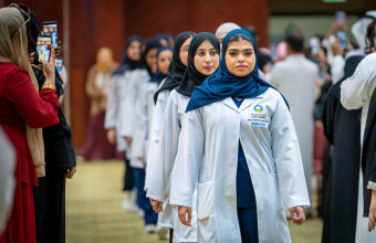 Students of the College of Pharmacy and Health Sciences Prepare to Begin Their Professional Journey at the White Coat Ceremony