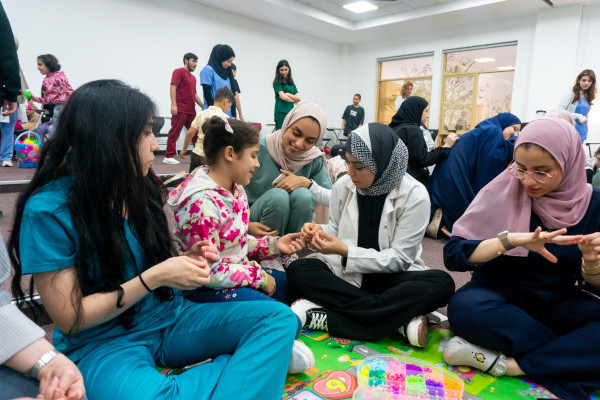 Student Clubs Celebrate International Happiness Day with Orphaned Children