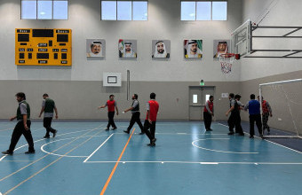 Ajman University’s Athletics Unit Organizes Futsal Tournament for Bus Drivers