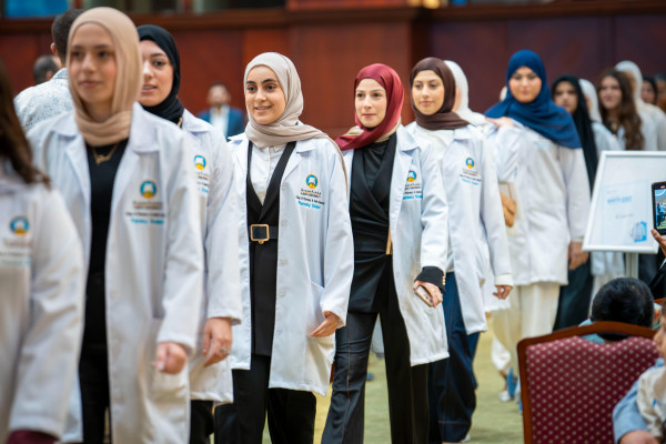 Students of the College of Pharmacy and Health Sciences Prepare to Begin Their Professional Journey at the White Coat Ceremony
